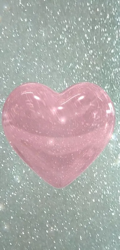 Glittery pink heart on teal background wallpaper.