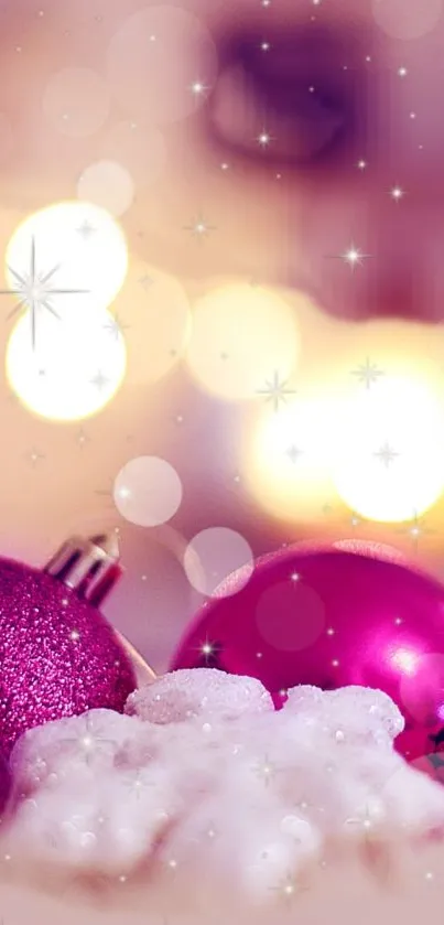 Pink Christmas ornaments with golden sparkles.