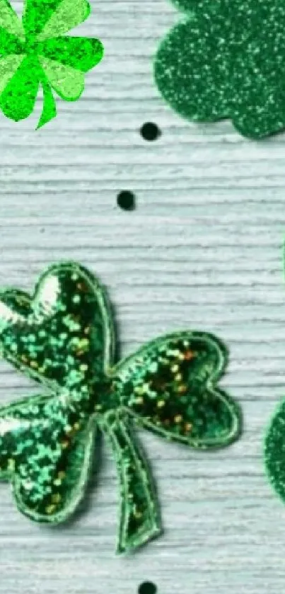 Glittery green shamrocks on a textured background.