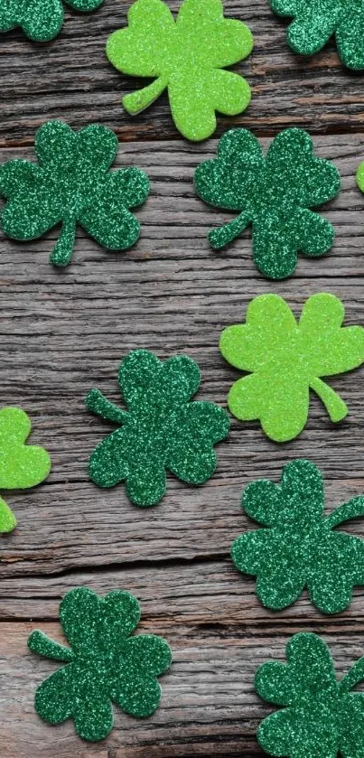 Glittery green shamrocks on wooden texture wallpaper.