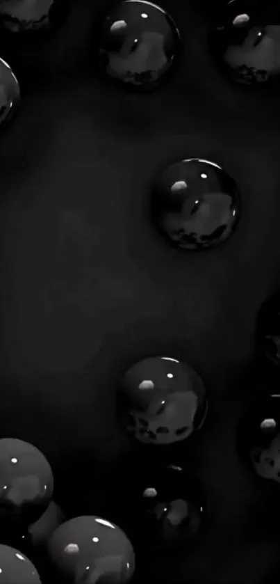Glossy black spheres on a dark background wallpaper.