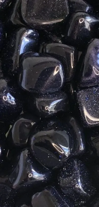 Glossy black stones with a polished surface for a sleek wallpaper.