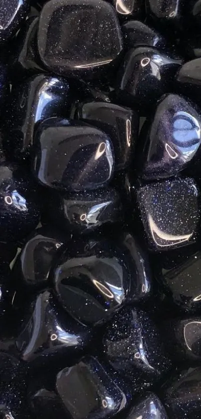 Glossy black stones create a modern, elegant phone wallpaper.