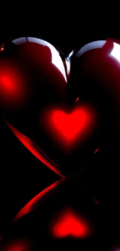 Glossy red heart on black background with a shiny effect.