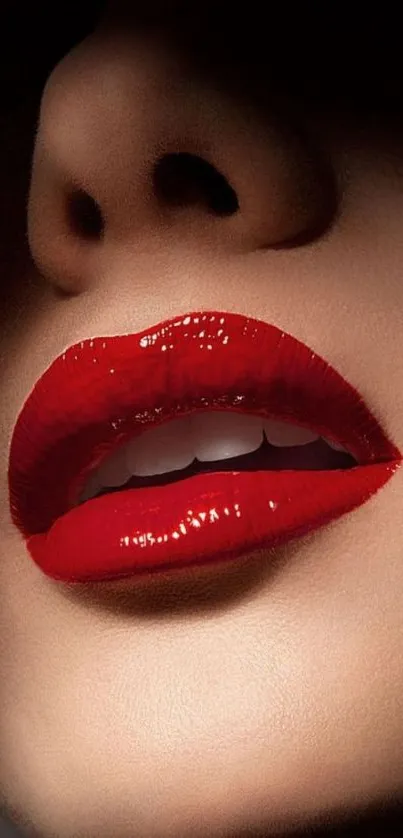 Close-up image of glossy red lips on a mobile wallpaper.