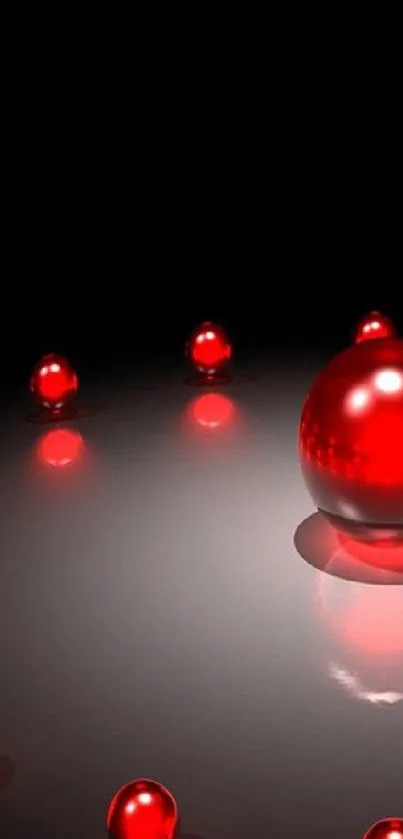 Glossy red spheres on a black backdrop.