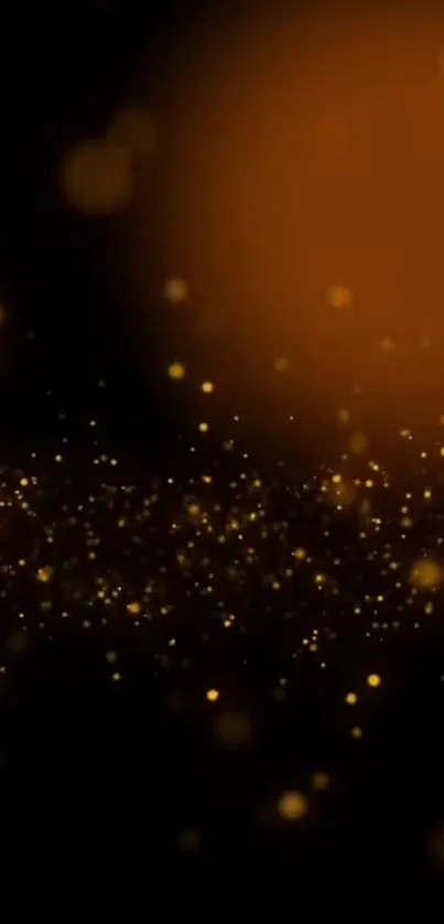 Abstract wallpaper with glowing golden particles on a black background.