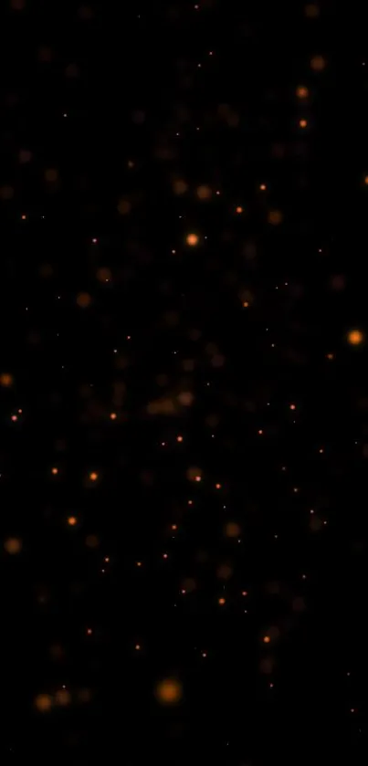 Wallpaper with glowing amber particles on a black background.