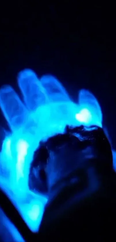 Glowing blue hand with neon effect on dark background.