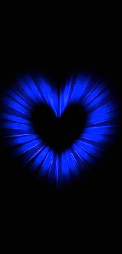 Blue heart glow on black background.