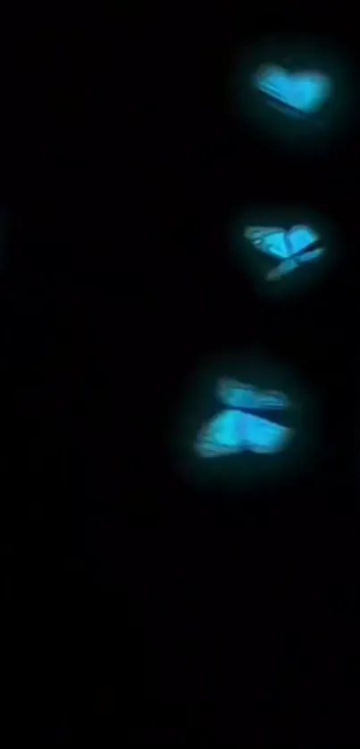 Glowing blue butterflies in a dark space, creating a mystical phone wallpaper.