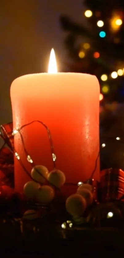 Glowing red candle with Christmas lights in a cozy setting.