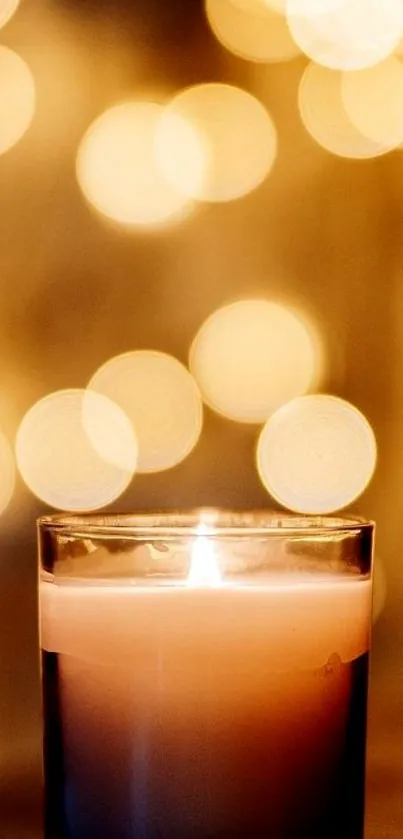 Glowing candle with soft golden bokeh background.