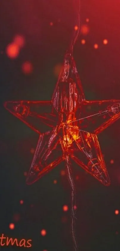 Glowing red Christmas star on dark background wallpaper.