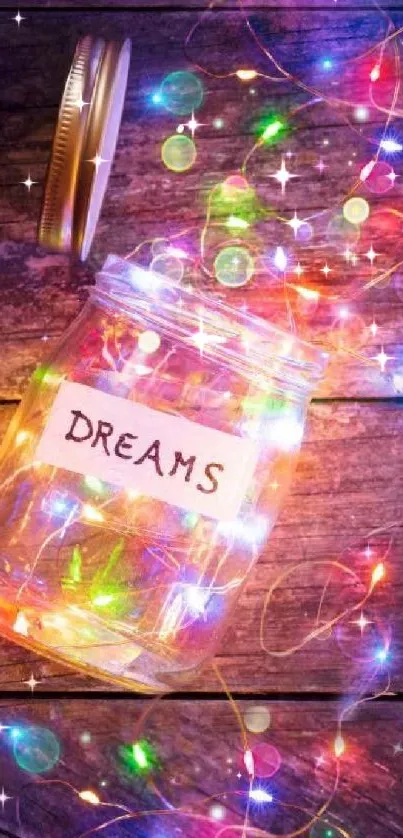 Jar of colorful lights labeled 'Dreams' on rustic wood.