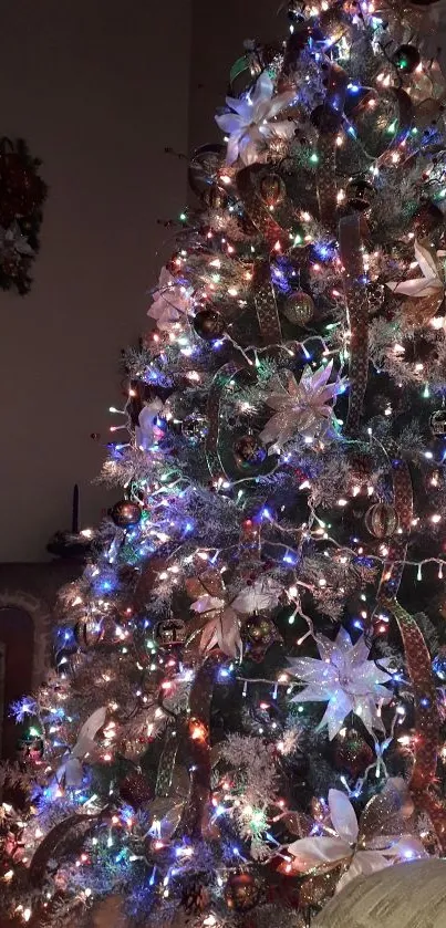 Festively lit Christmas tree with colorful decorations.