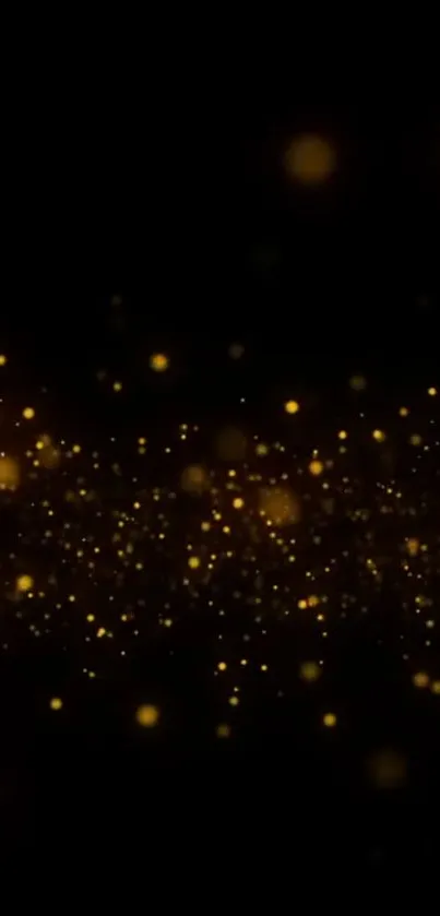 Mobile wallpaper featuring glowing gold sparkles on a black background.