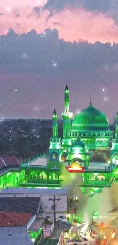 A beautifully illuminated green mosque glowing under a night sky with twinkling stars.