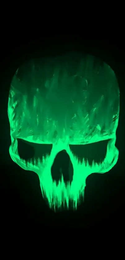 Eerie glowing green skull on dark background.