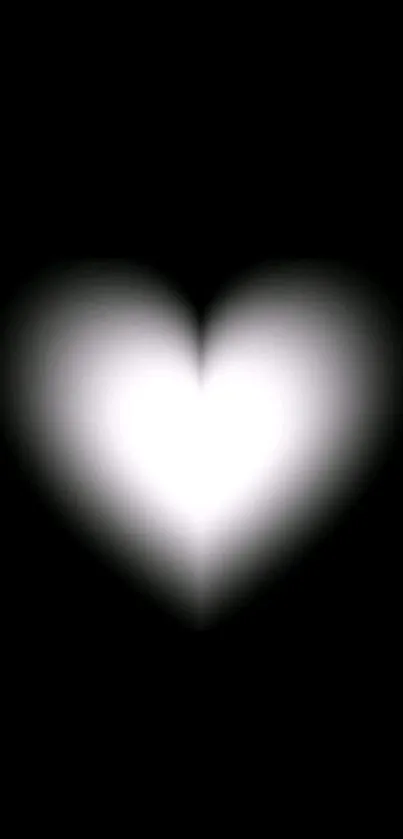 Glowing white heart on a black background wallpaper.