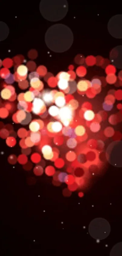 Glowing heart with red bokeh lights on a dark background.