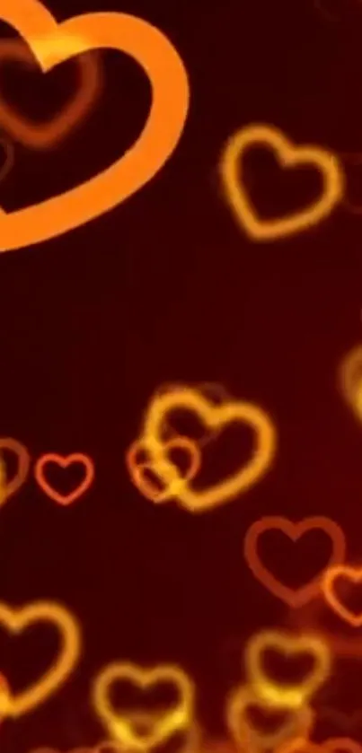 Glowing orange and red heart pattern wallpaper.