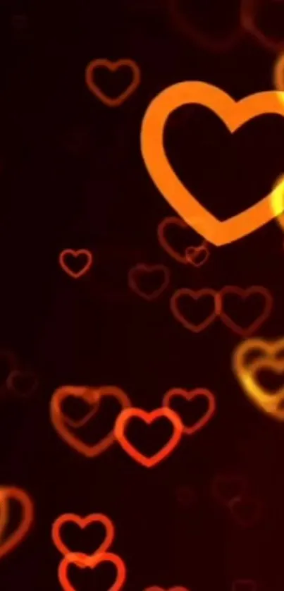 Glowing orange hearts wallpaper with black background.