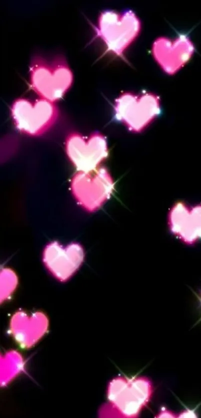 Glowing pink hearts on black background wallpaper.