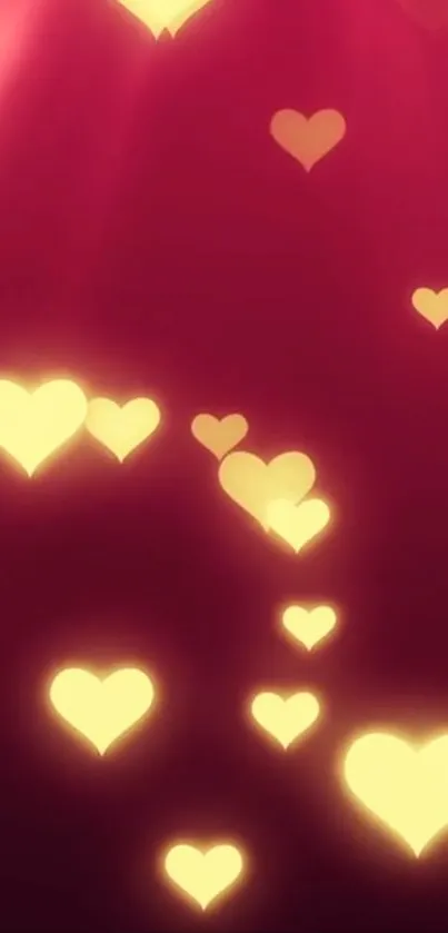 Luminous golden hearts on deep red background wallpaper.