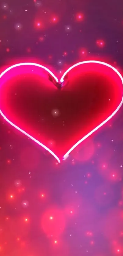 Glowing pink neon heart on dark background.