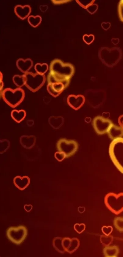 Red and gold glowing heart pattern on a mobile wallpaper.