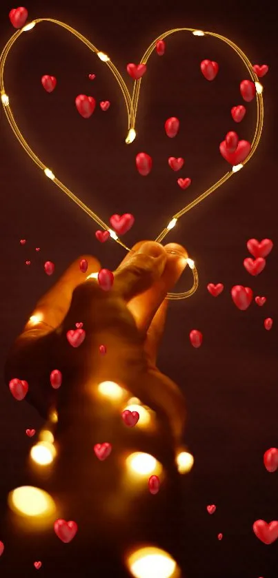 Hand holding glowing heart-shaped string lights over a dark background.