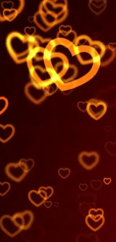 Glowing orange hearts on a rich red background forming a lively wallpaper.