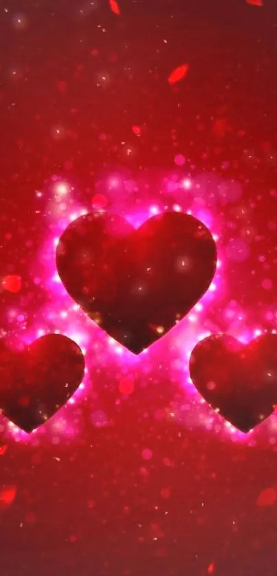 Vibrant red and pink glowing hearts wallpaper with sparkling effects.