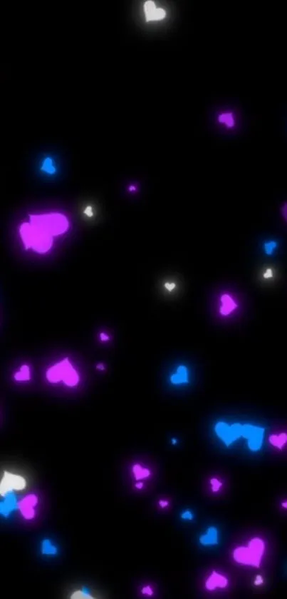 Vibrant glowing hearts on a dark background wallpaper.