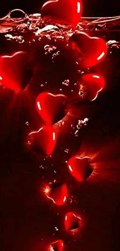 Glowing red hearts submerged underwater, creating a romantic visual.