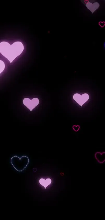 Mobile wallpaper with glowing hearts on a black background.