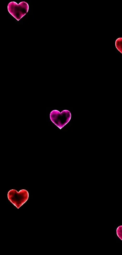 Mobile wallpaper featuring glowing red and pink hearts on a black background.