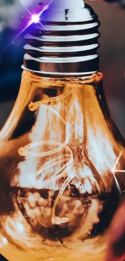 Vivid close-up of a glowing amber light bulb with a blue highlight.