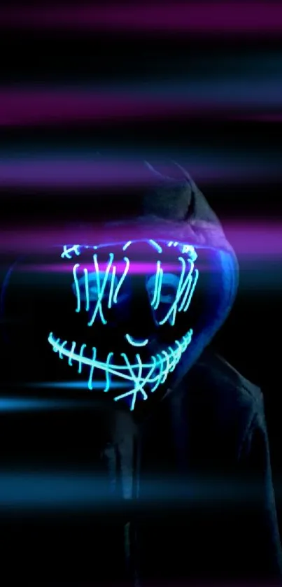 Hooded figure with glowing neon mask against black background.