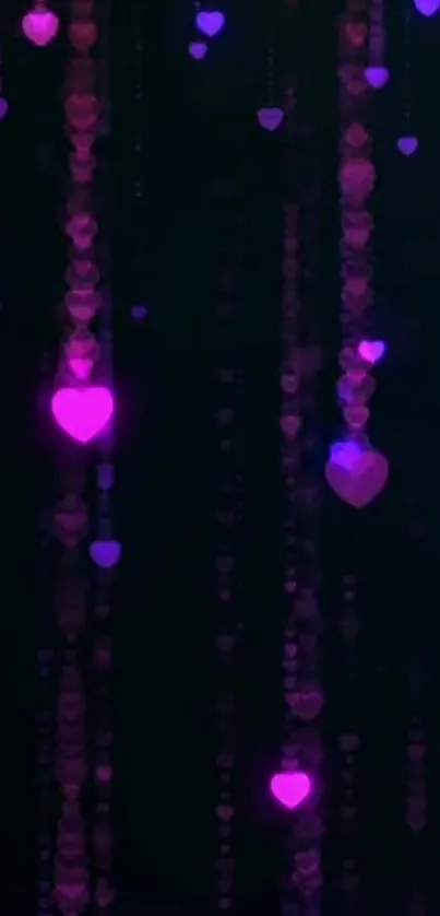 Glowing hearts on a dark background wallpaper.