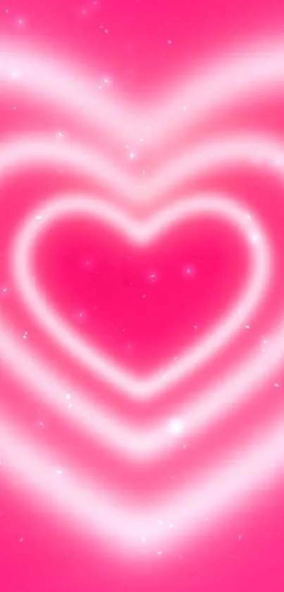 Glowing pink heart wallpaper with concentric heart design.