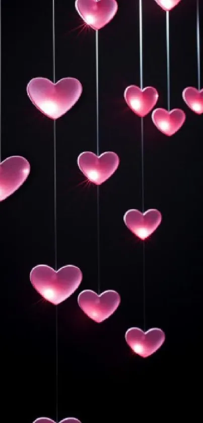 Mobile wallpaper with glowing pink hearts on black background.