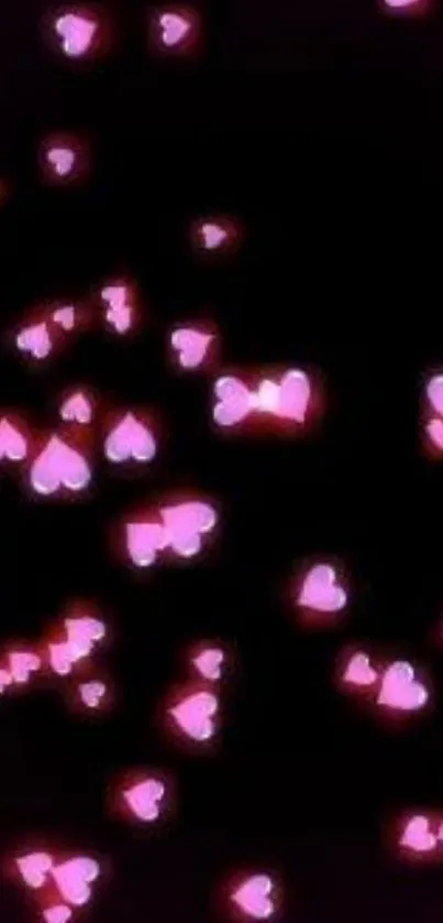 Glowing pink hearts on a dark background mobile wallpaper.