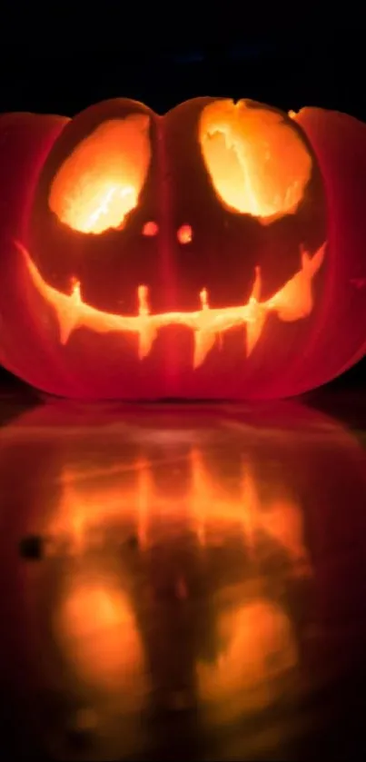 Eerie glowing jack-o-lantern with dark background on Halloween night.