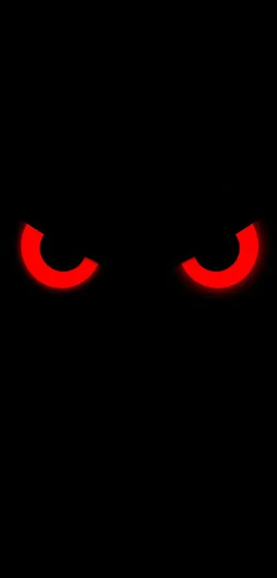 Mysterious dark wallpaper with glowing red eyes.