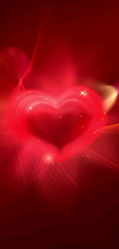 Glowing red heart on vibrant background wallpaper.