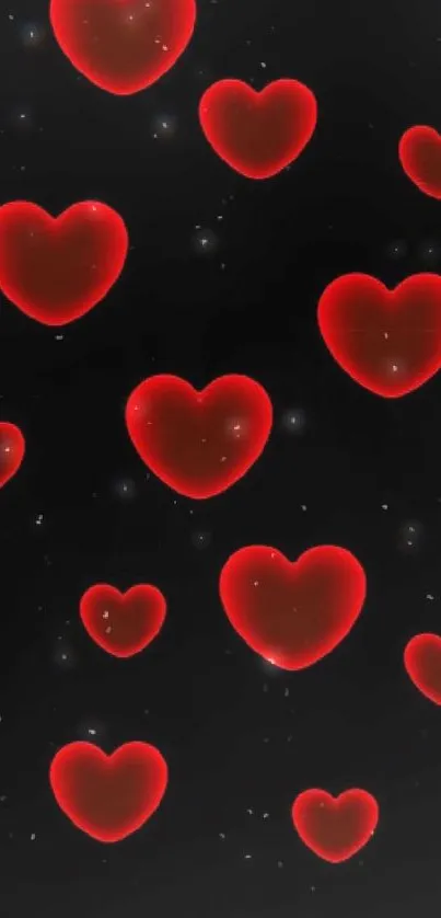 Vibrant mobile wallpaper of glowing red hearts on a black background.