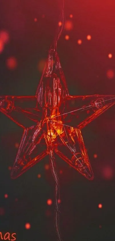 Glowing red star ornament on dark background