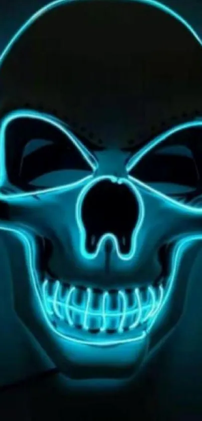 Glowing neon skull with blue lighting on dark background.